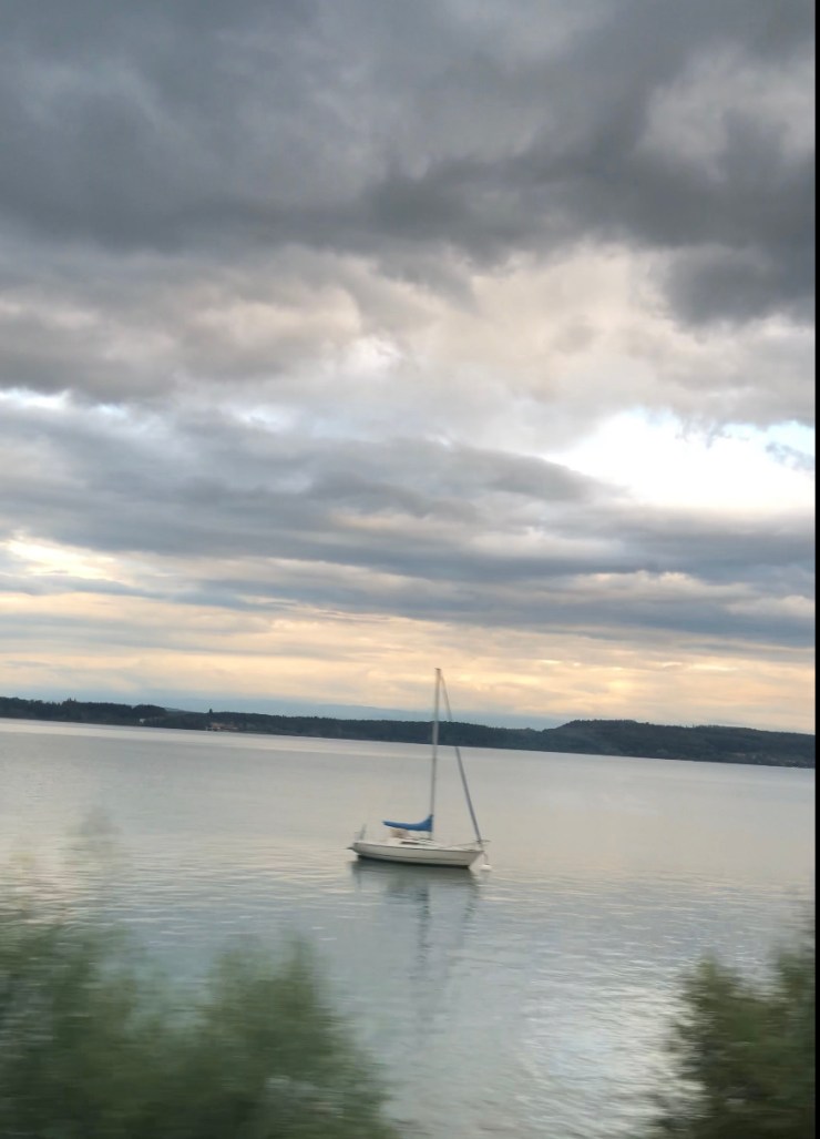 A boat on lake Geneva at sunset